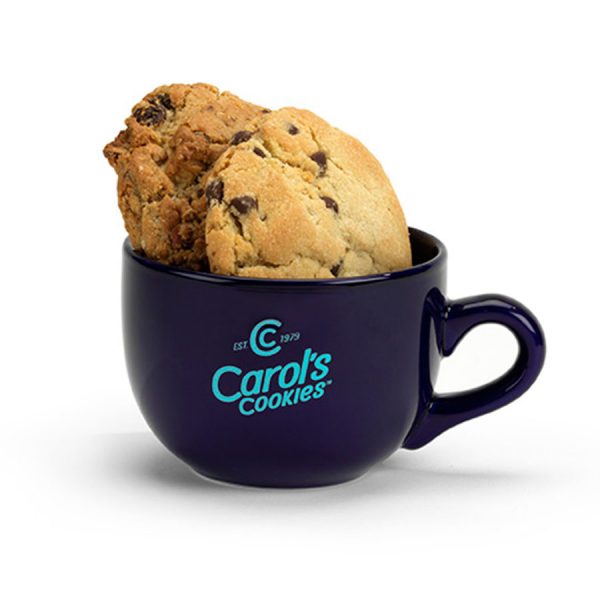 A Carol's Cookies branded mug filled with two gourmet cookies.