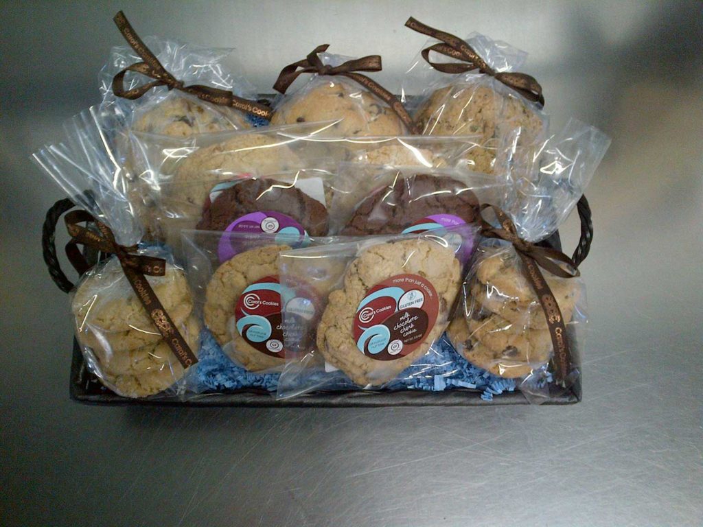 A basket of assorted, ribbon-tied cookies, perfect for gifting.