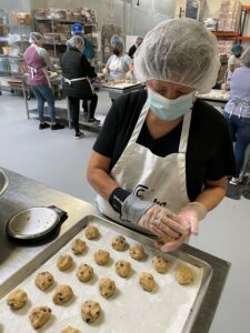 Carol's Cookies employee baking cookies